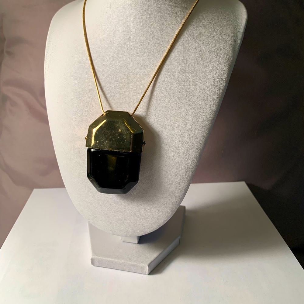 Black and gold colored necklace